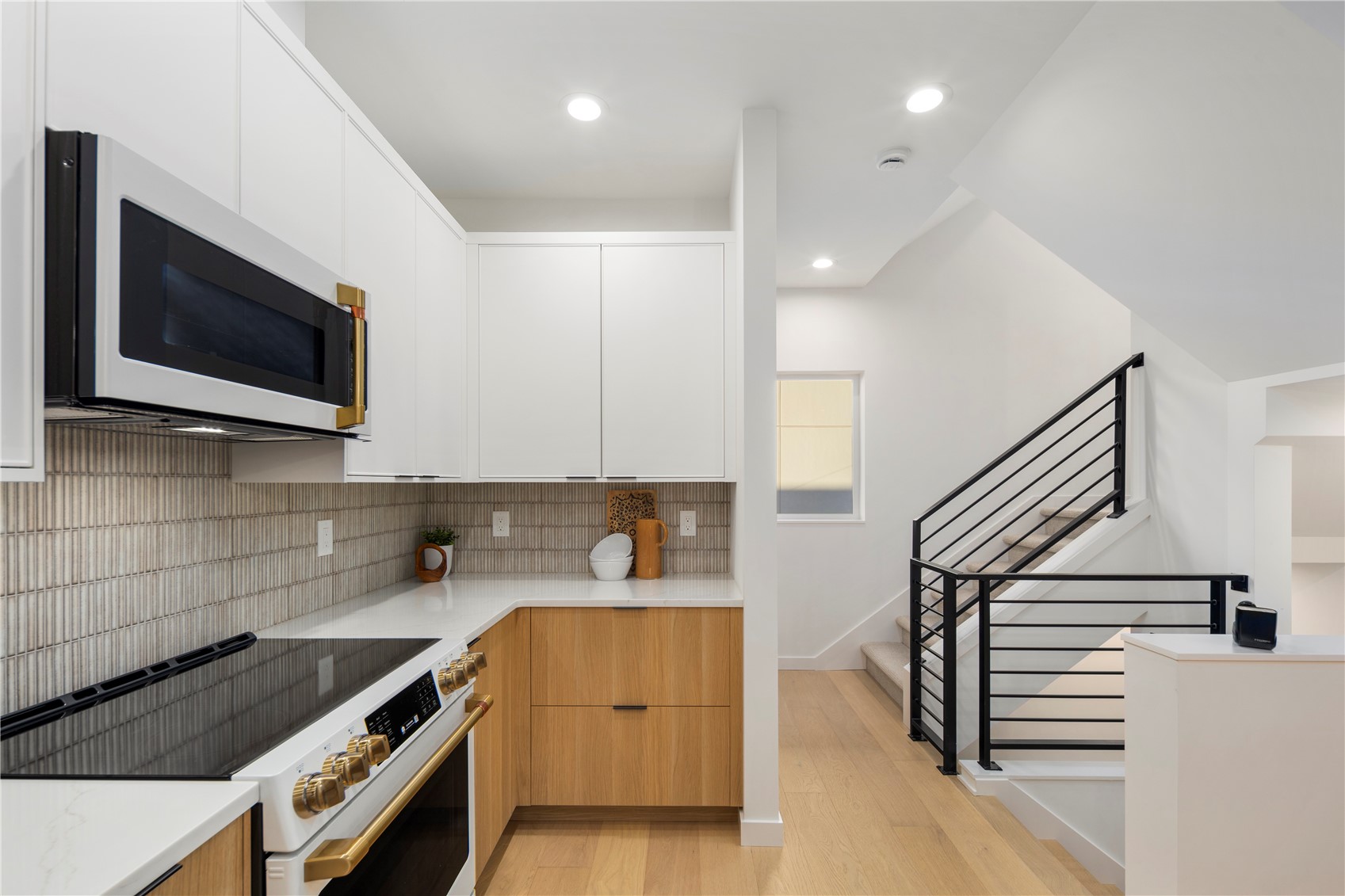 4121 B Chilberg Avenue Southwest Seattle, WA 98116 - Photo 5 of 29 a kitchen with a sink a microwave and cabinets