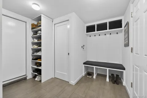 a view of an empty room with cabinet and workspace