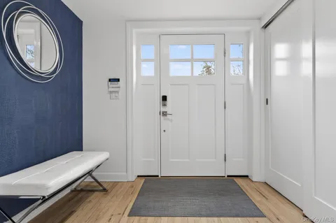 a view of a room with wooden floor and bathroom