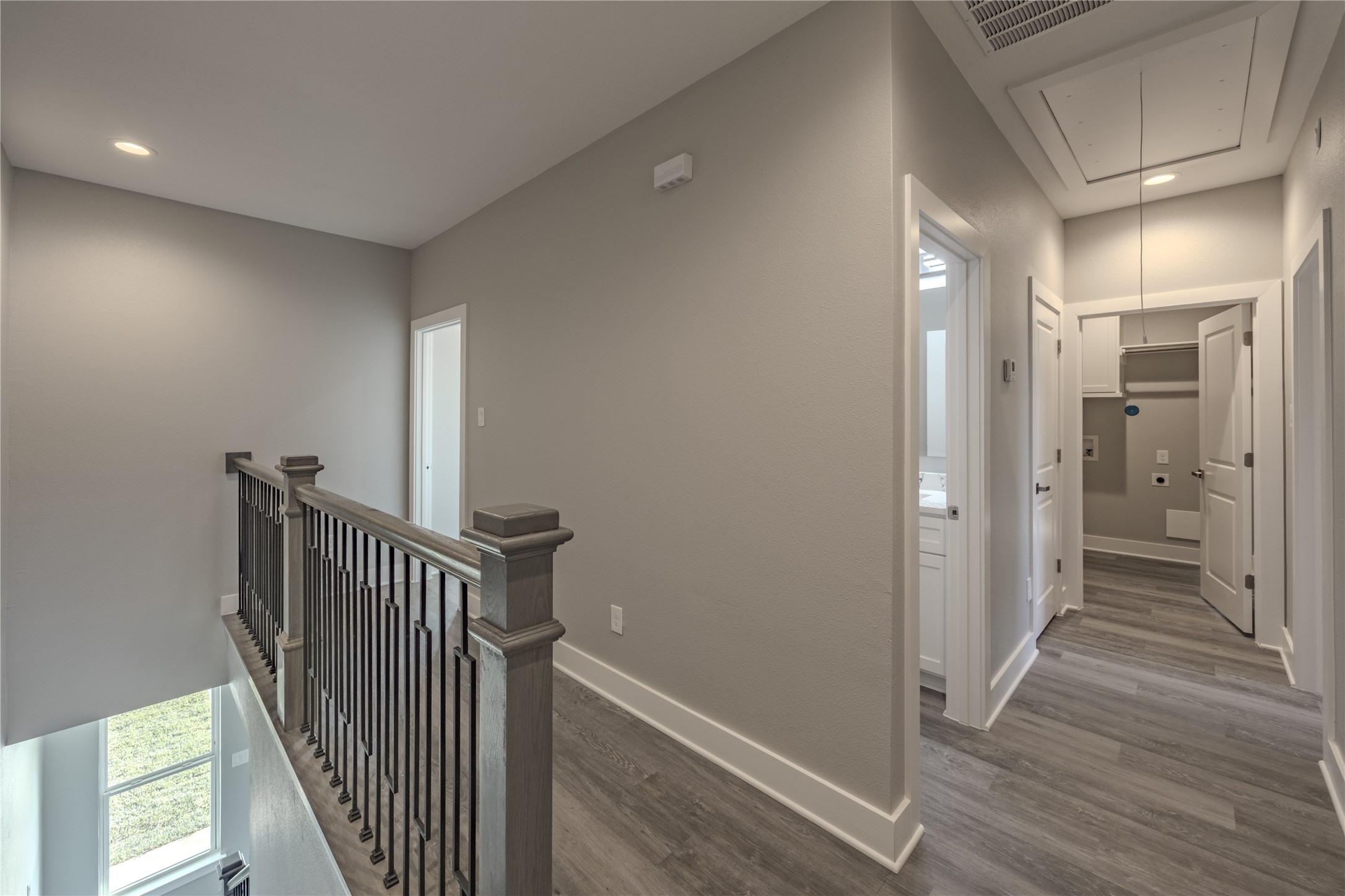 737 Ebenezer Lane Brenham, TX 77833 - Photo 14 of 25 a view of a hallway with wooden floor