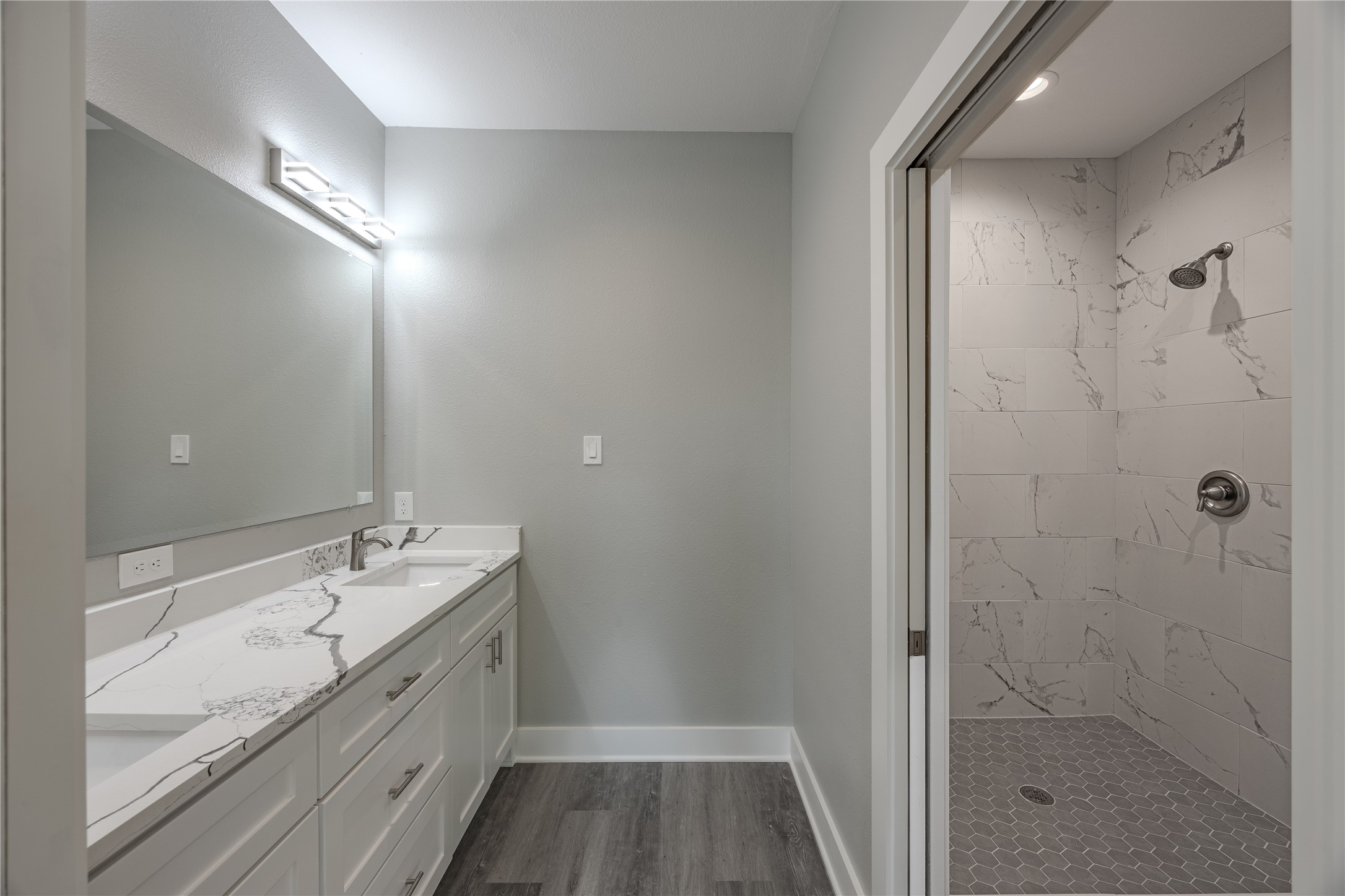 737 Ebenezer Lane Brenham, TX 77833 - Photo 17 of 25 a bathroom with a double vanity sink and a mirror