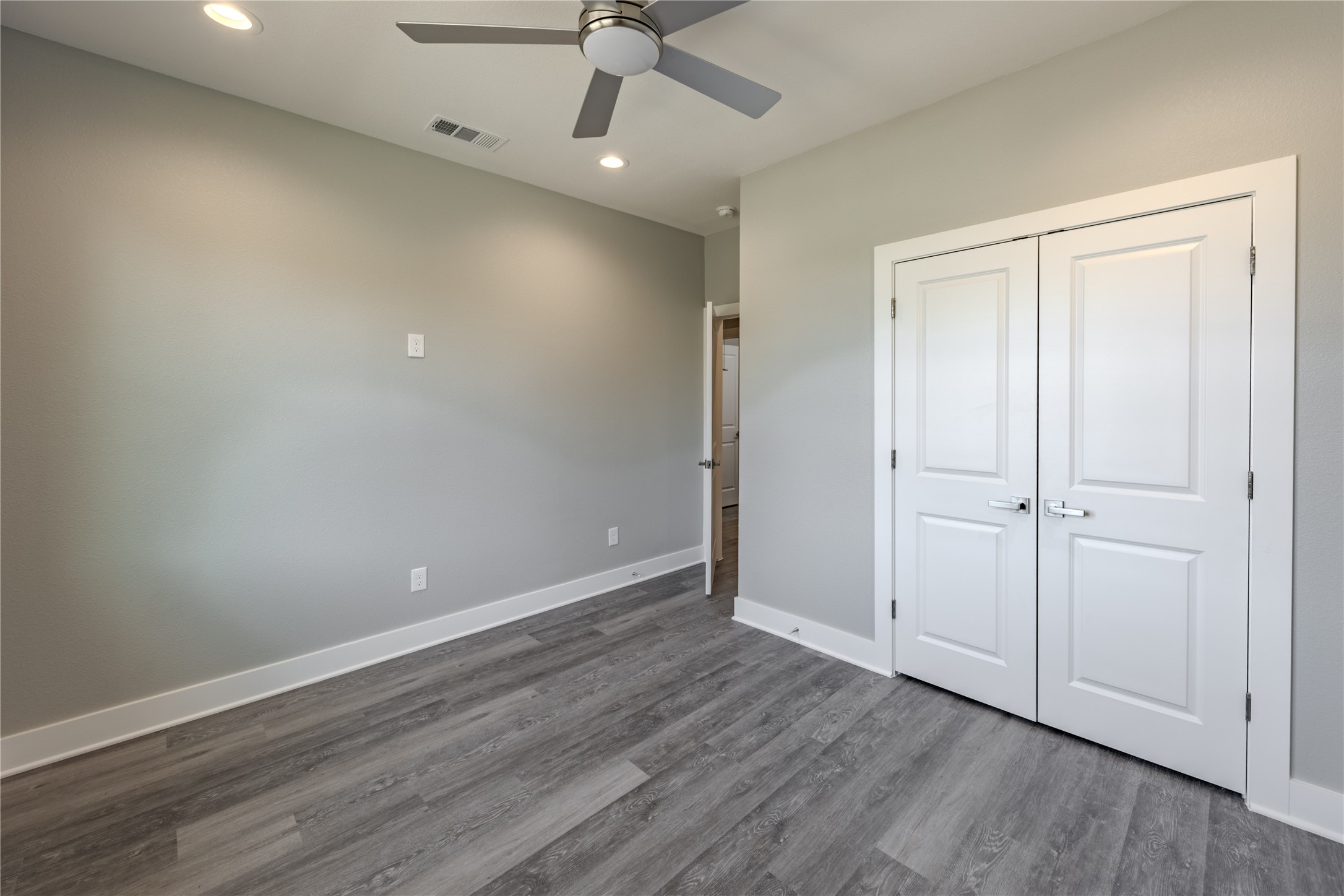737 Ebenezer Lane Brenham, TX 77833 - Photo 22 of 25 an empty room with a hardwood & ceiling fan