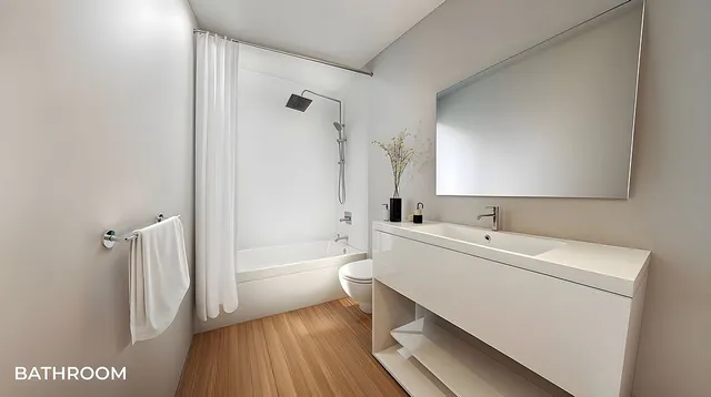 a bathroom with a sink a toilet and a bathtub