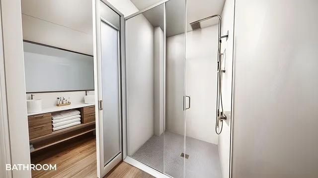 a bathroom with a shower and a sink