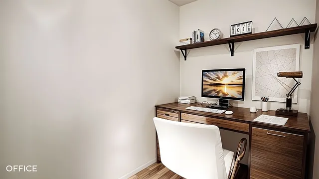 a room with wooden floor and a mirror