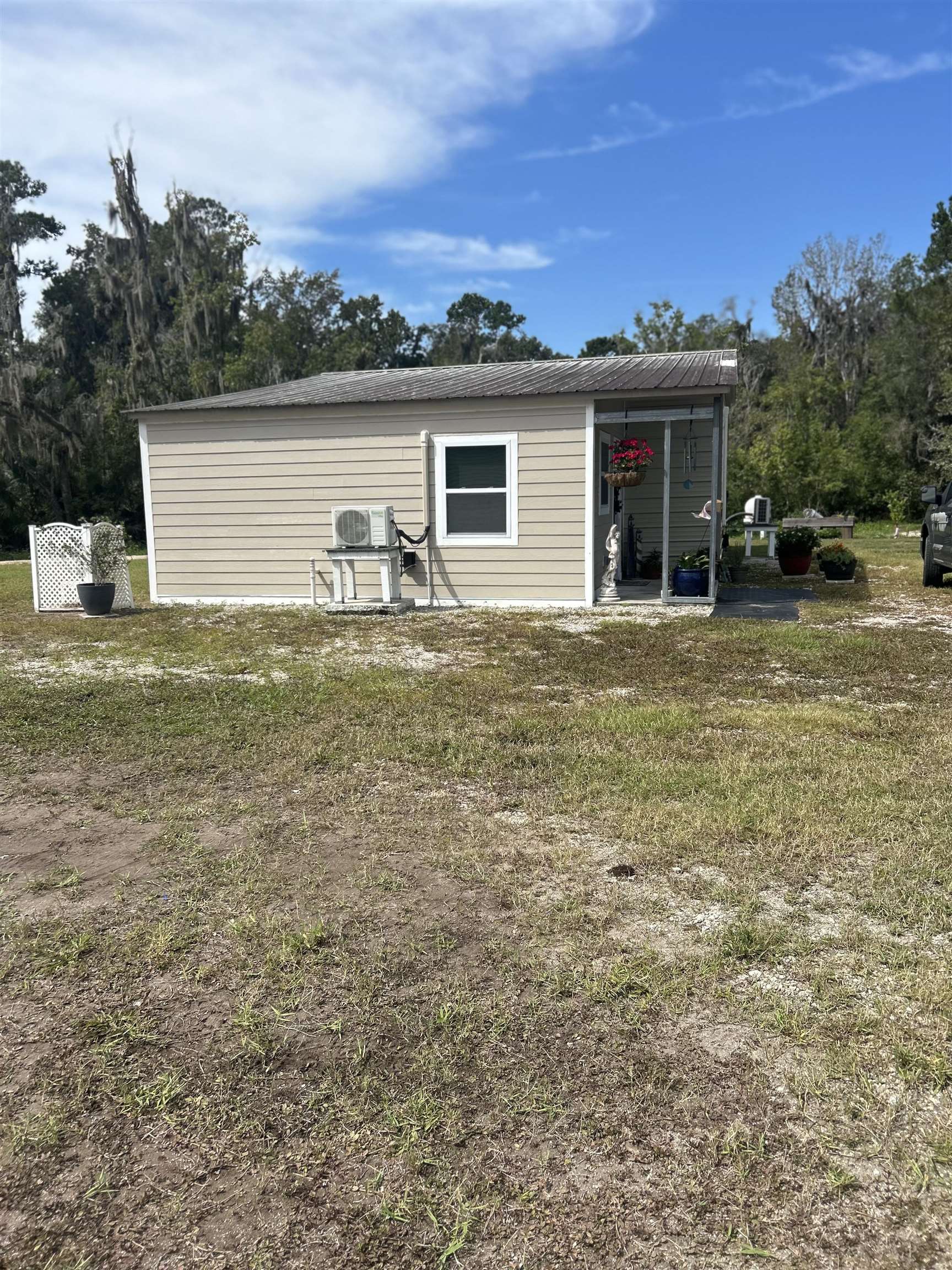 173 Dog Branch Road East Palatka, FL 32131 - Photo 5 of 15 a view of a house with a yard