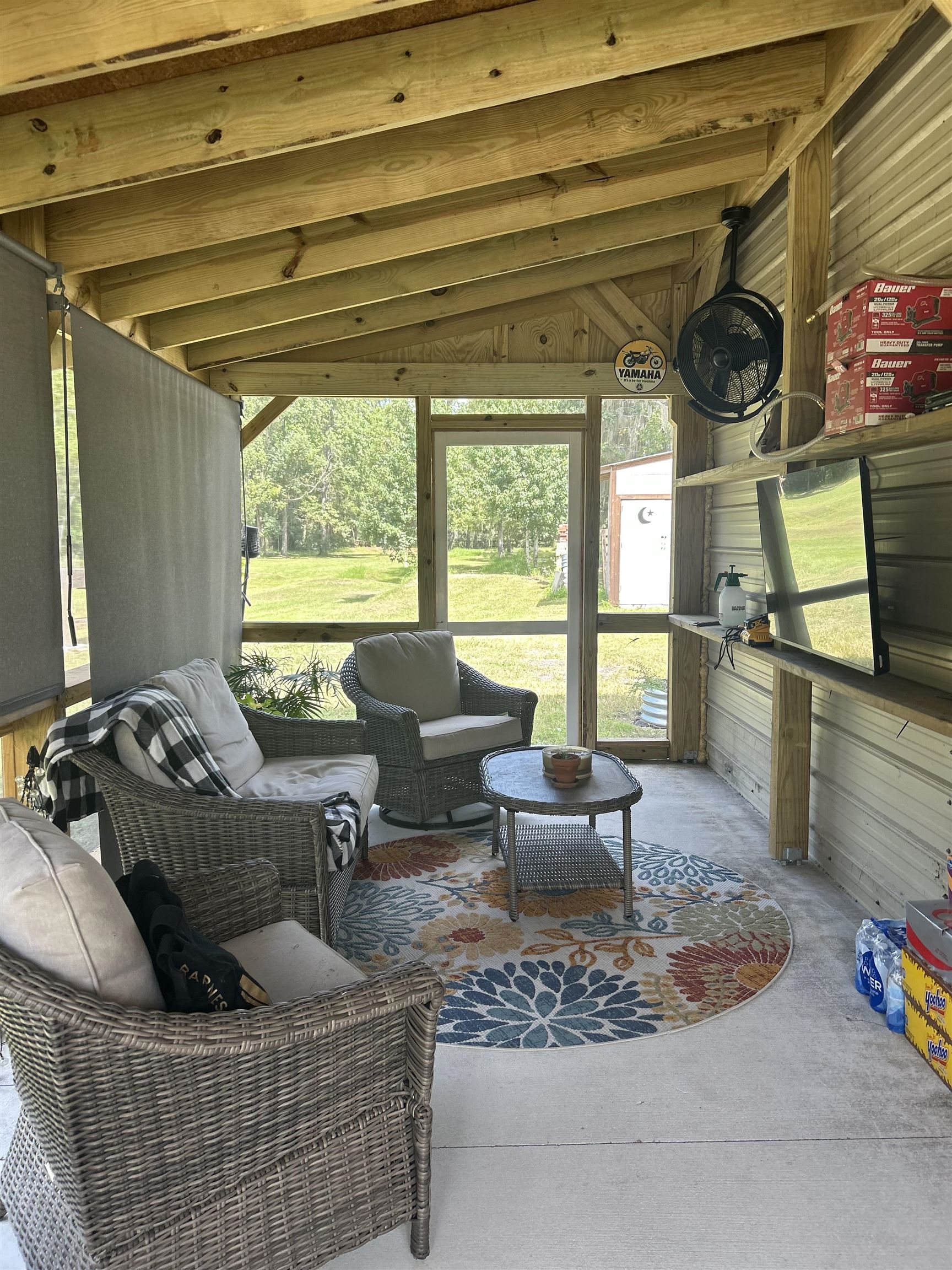173 Dog Branch Road East Palatka, FL 32131 - Photo 6 of 15 a living room with furniture and a floor to ceiling window