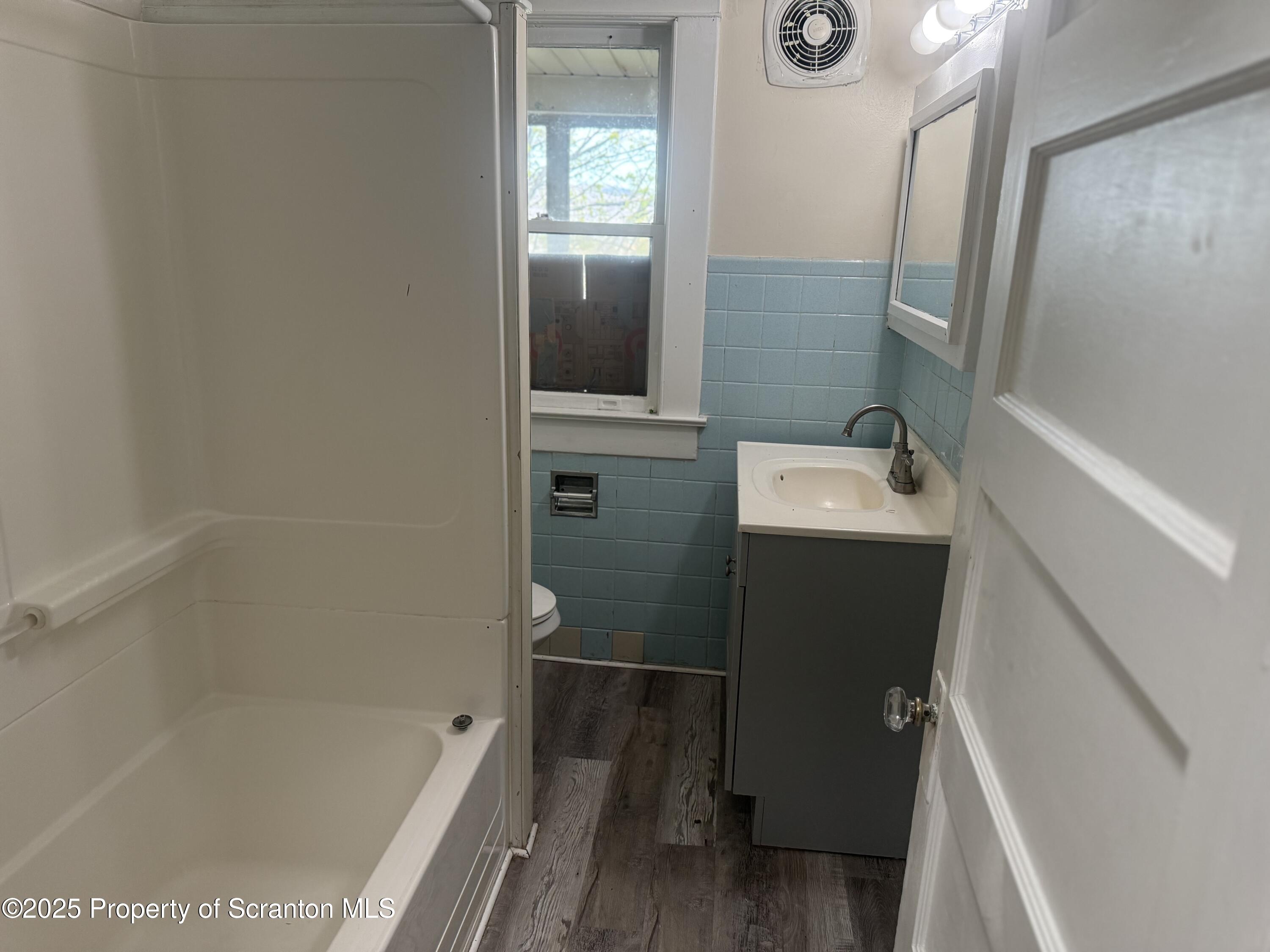 315 Wheeler Avenue Scranton, PA 18510 - Photo 11 of 18 a bathroom with a sink a toilet and shower