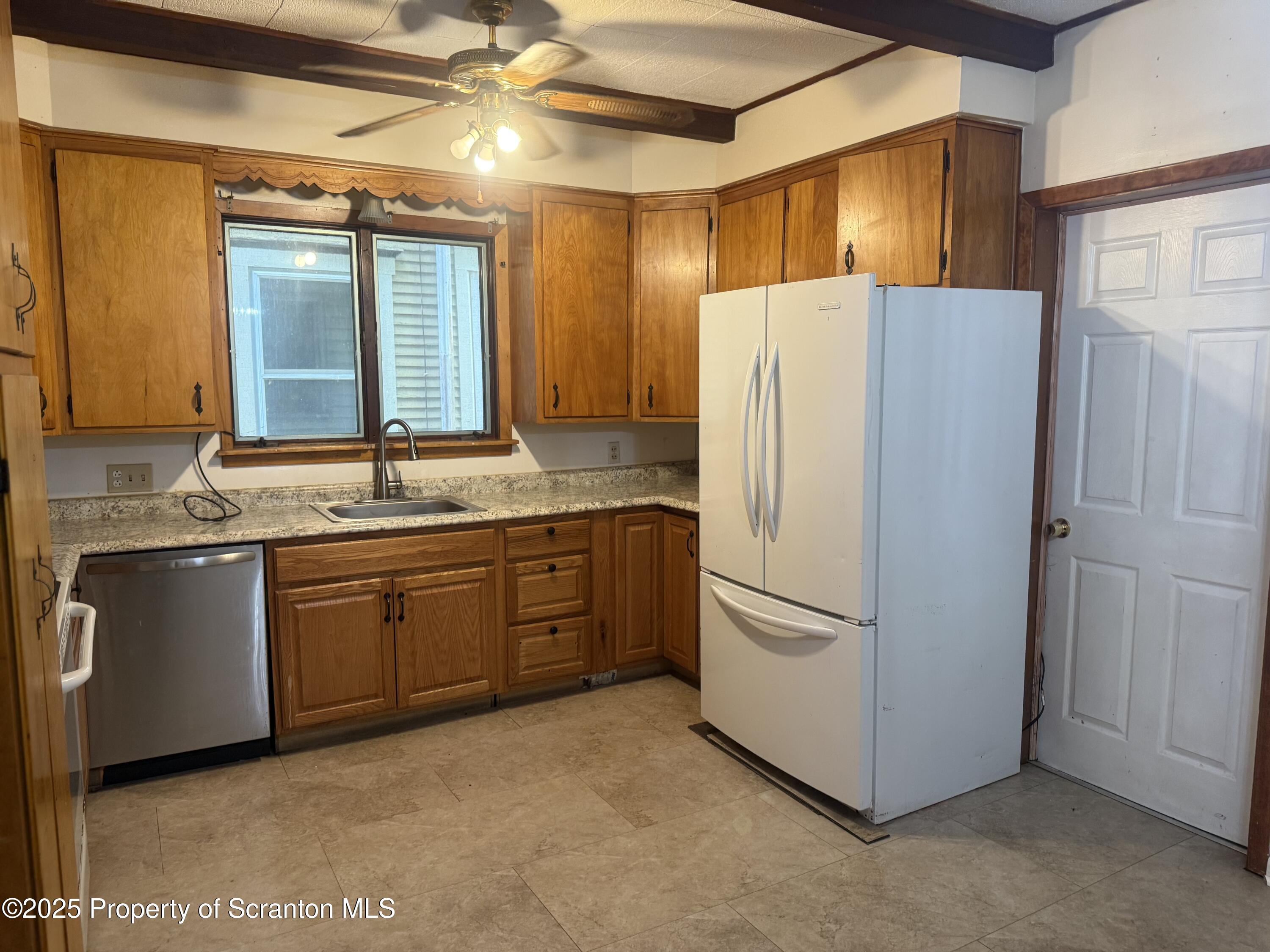 315 Wheeler Avenue Scranton, PA 18510 - Photo 6 of 18 a white refrigerator freezer sitting in a kitchen