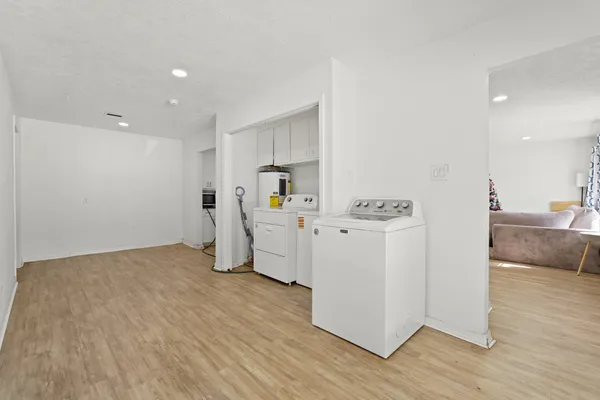 a view of a kitchen with wooden floor