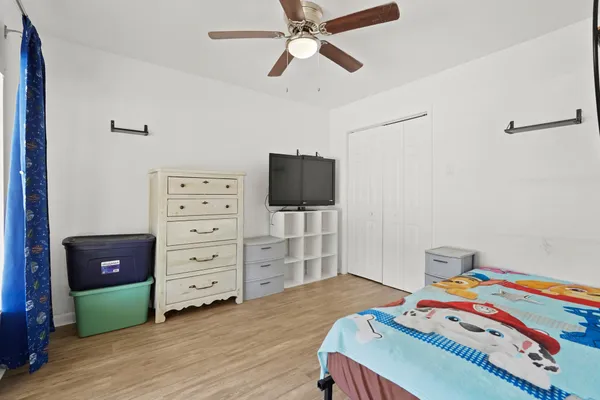 a bedroom with a bed and furniture