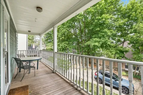 a view of balcony with furniture