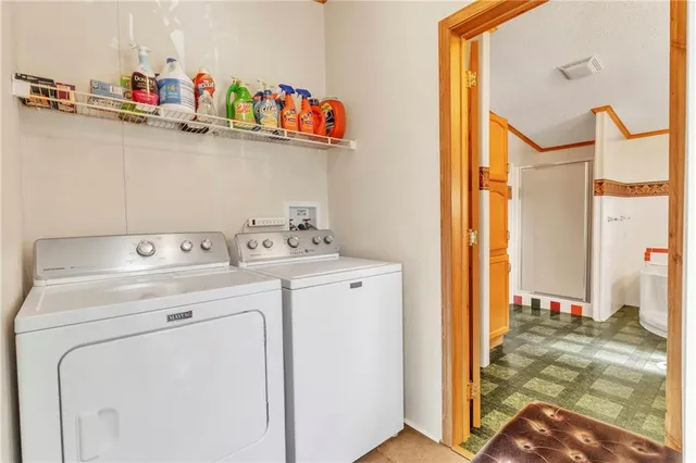 a view of a chairs and table in the balcony