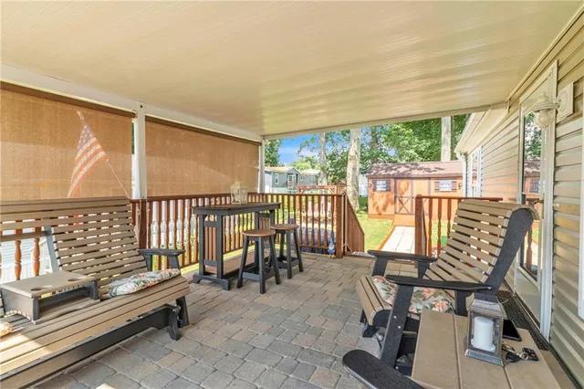 a view of swimming pool with seating area