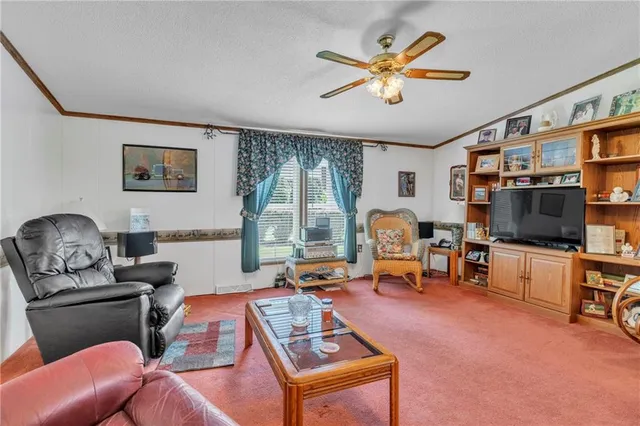 a living room with furniture or couch and a flat screen tv