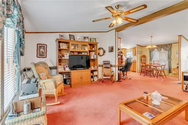 a living room with furniture and white walls