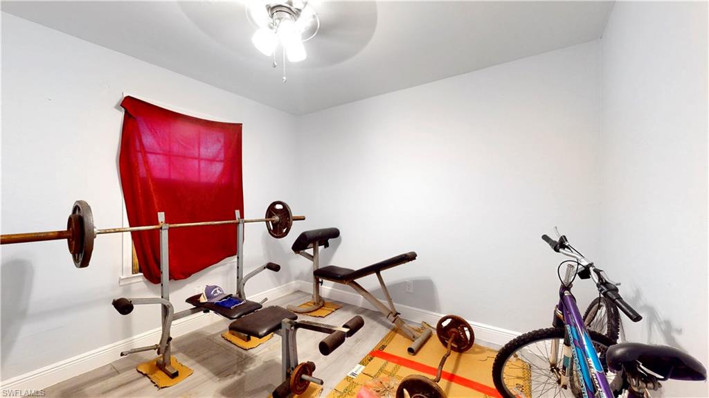 3903 35th Street Southwest Lehigh Acres, FL 33976 - Photo 13 of 16 a view of a room with gym equipment