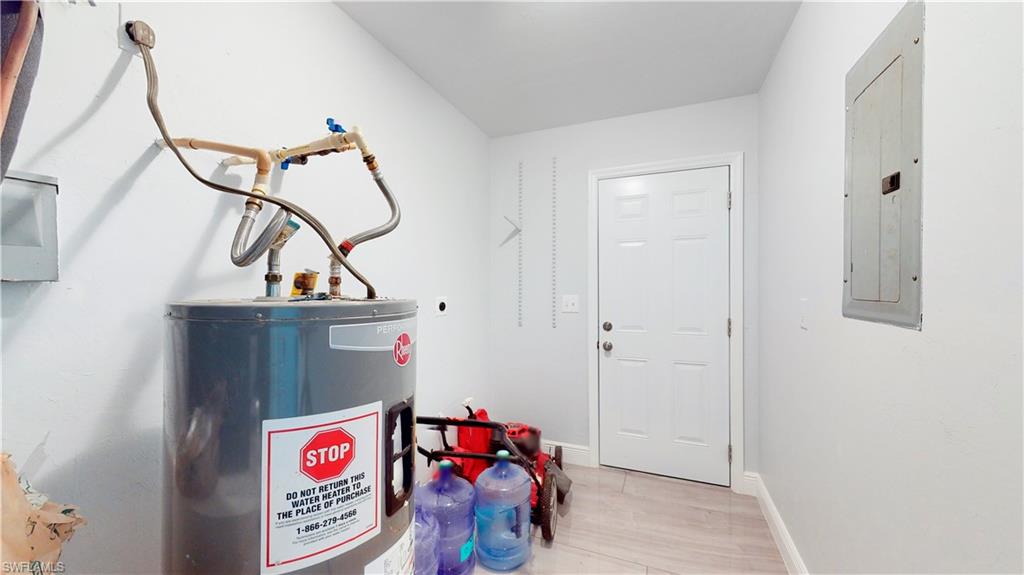 3903 35th Street Southwest Lehigh Acres, FL 33976 - Photo 15 of 16 a view of an entryway with wooden floor