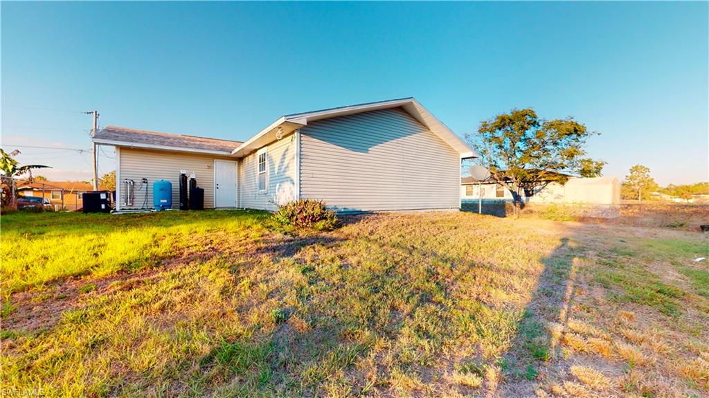 3903 35th Street Southwest Lehigh Acres, FL 33976 - Photo 16 of 16 a view of a house with swimming pool