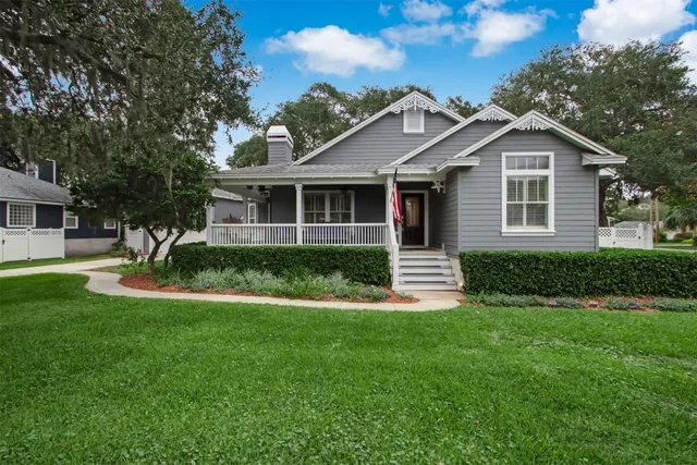 a front view of house with yard and green space
