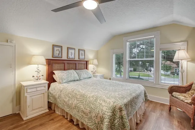 a bedroom with a large bed and a couch