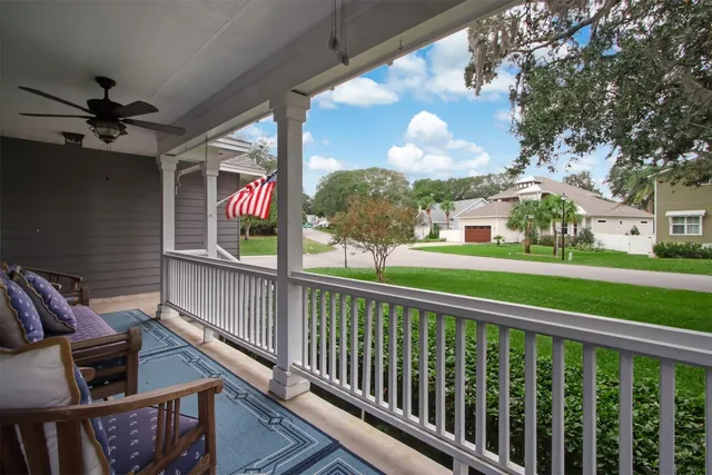 a view of a chairs and tables in the balcony