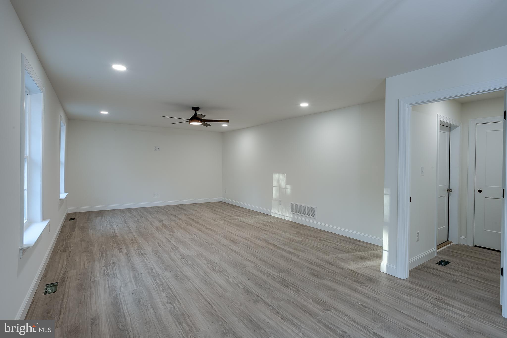 1427 Williamstown Erial Road Sicklerville, NJ 08081 - Photo 14 of 27 wooden floor in an empty room with a window