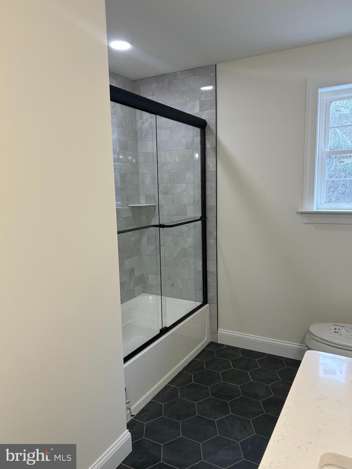 1427 Williamstown Erial Road Sicklerville, NJ 08081 - Photo 27 of 27 a bathroom with a glass shower door