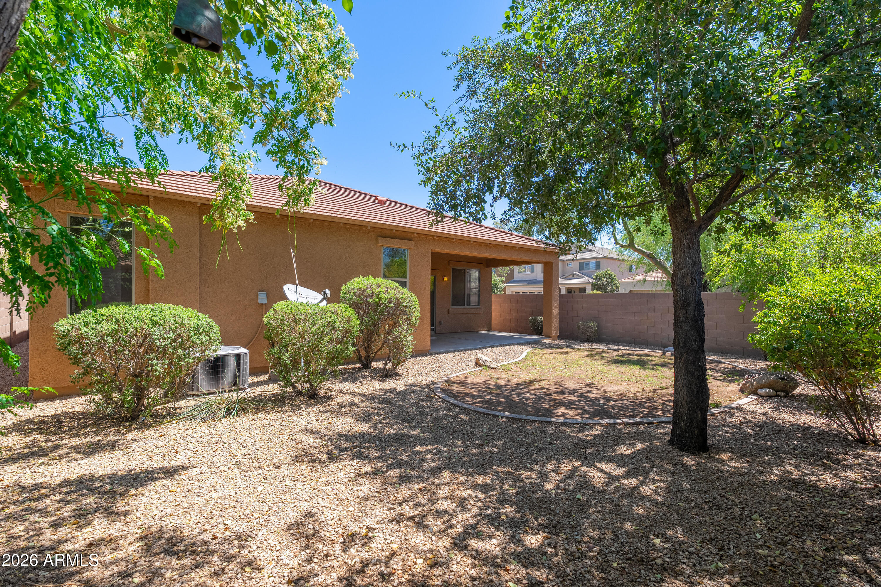 4317 East Folgers Road Phoenix, AZ 85050 - Photo 28 of 40 a view of a house with a tree