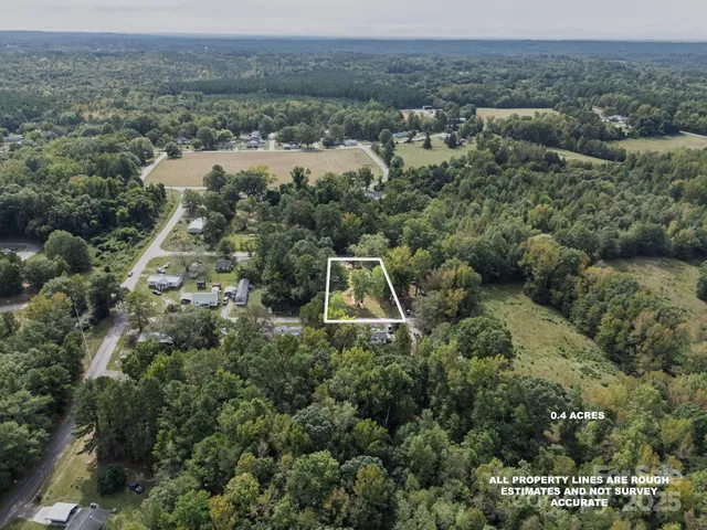 an aerial view of residential house with outdoor space