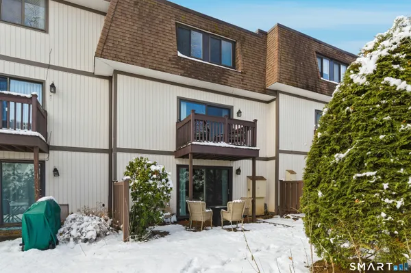 a view of a building with potted plants