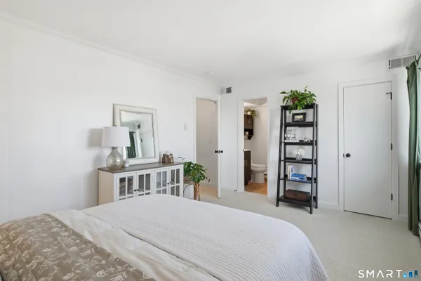 a bedroom with a bed and a cabinets