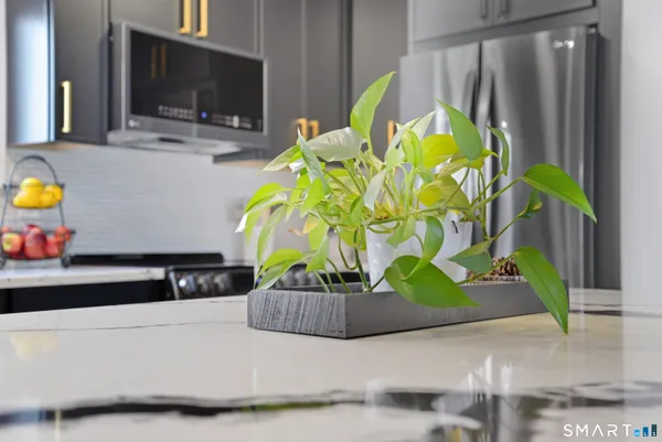 a living room with fireplace furniture and flat screen tv