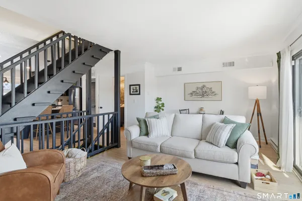 a living room with furniture and a table