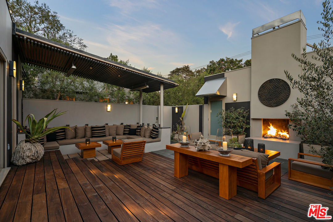 a outdoor living space with furniture and wooden floor