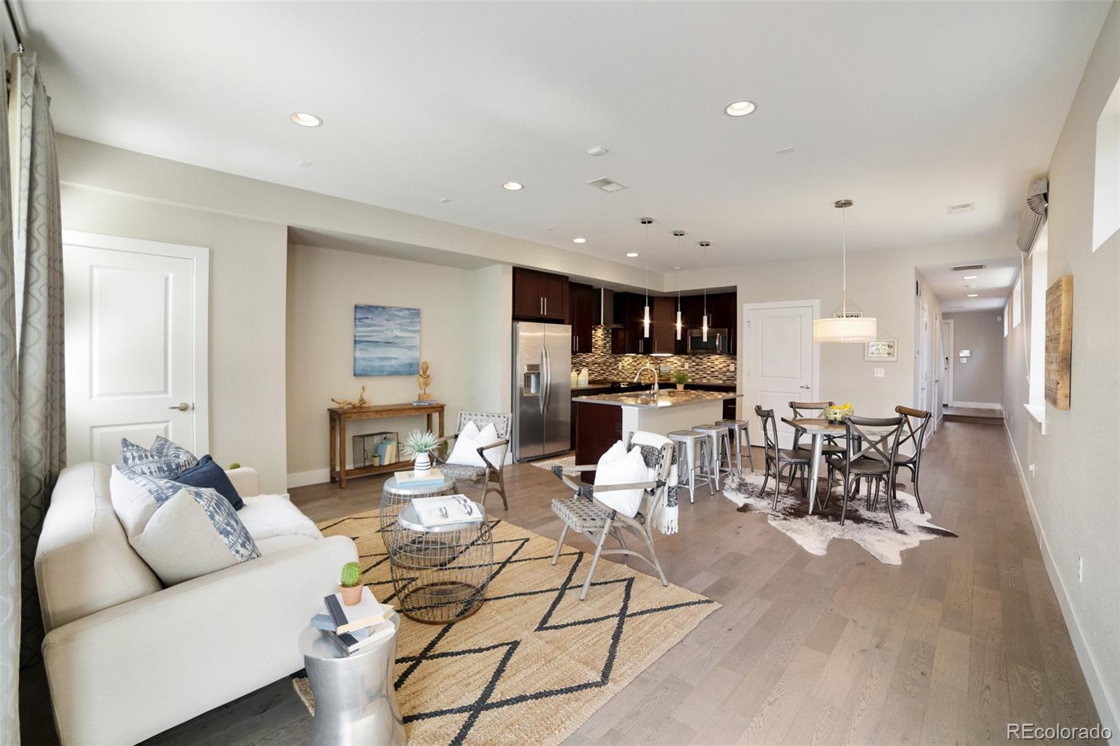Open floor plan with gorgeous hardwood floors and tons of natural sunlight!