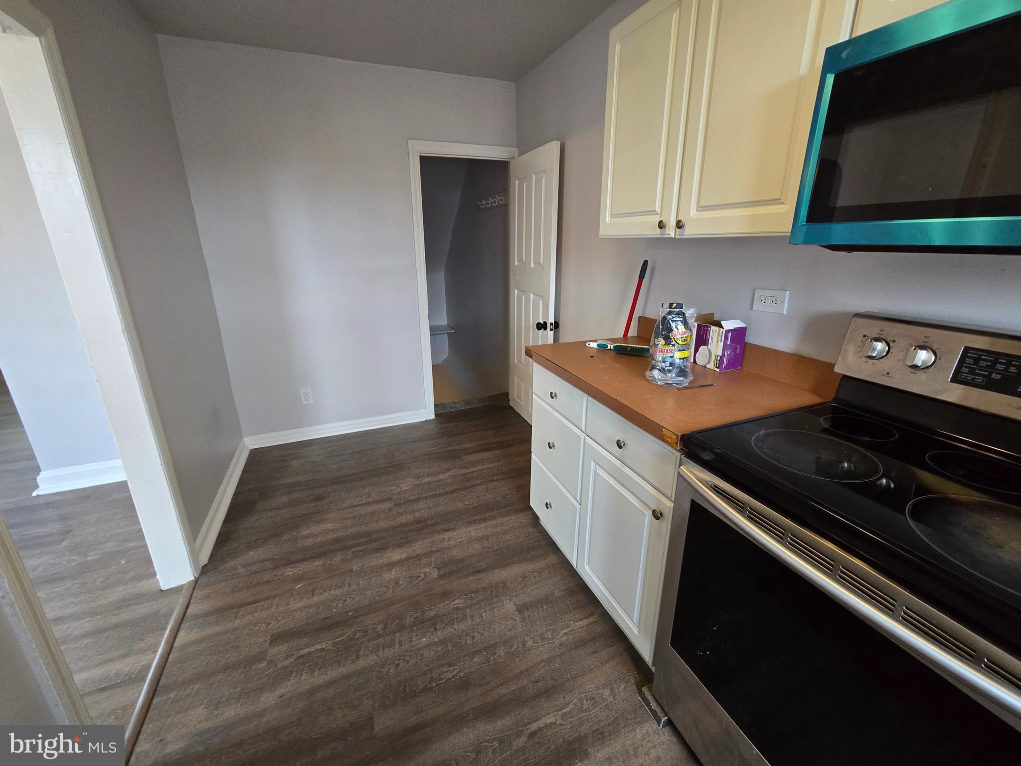 201 St Laurence Road Upper Darby, PA 19082 - Photo 14 of 37 a kitchen with a stove and a microwave