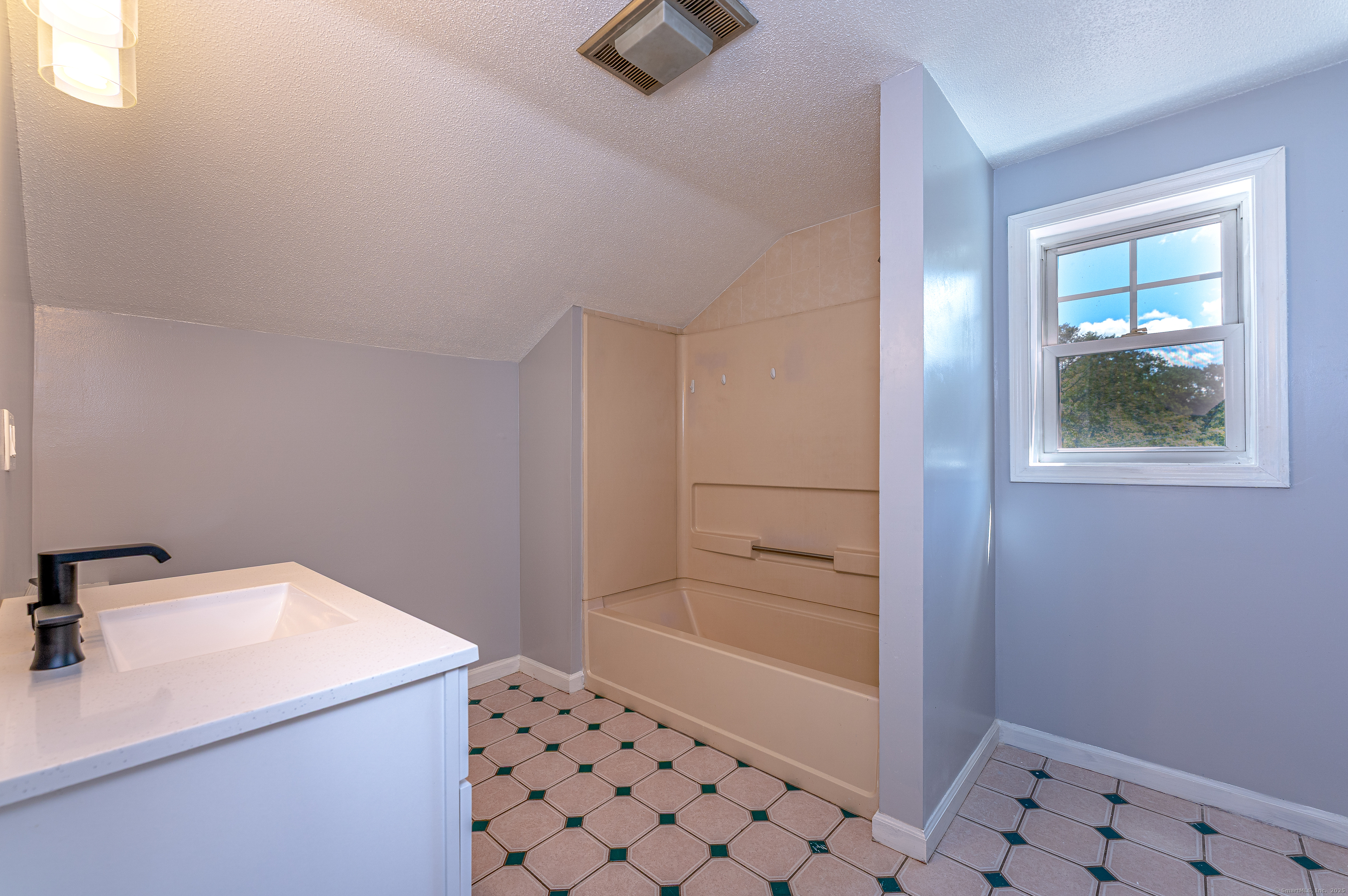 8 Ranslow Drive Wolcott, CT 06716 - Photo 20 of 31 a bathroom with a sink and a shower