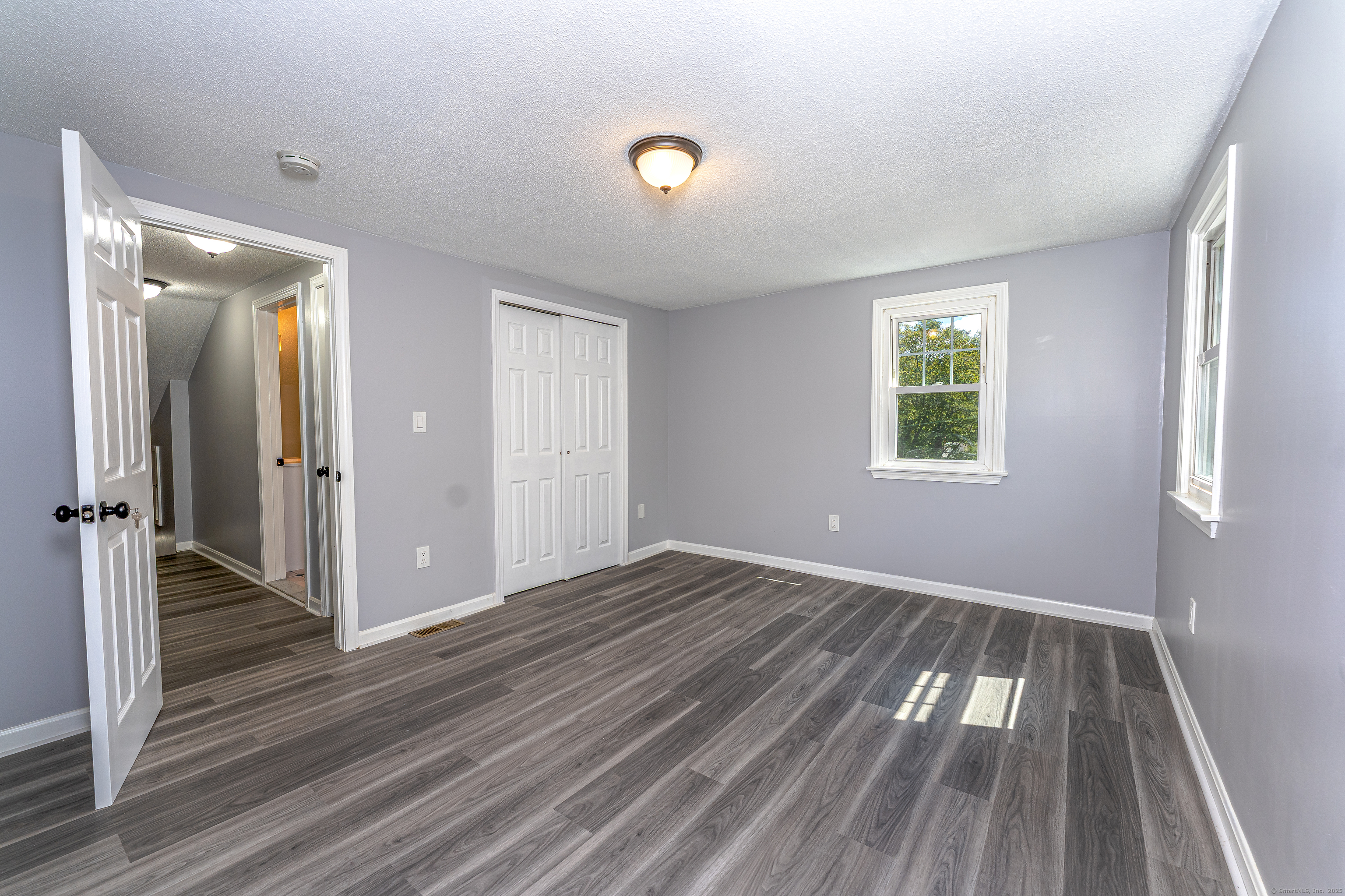 8 Ranslow Drive Wolcott, CT 06716 - Photo 22 of 31 wooden floor in an empty room with a window