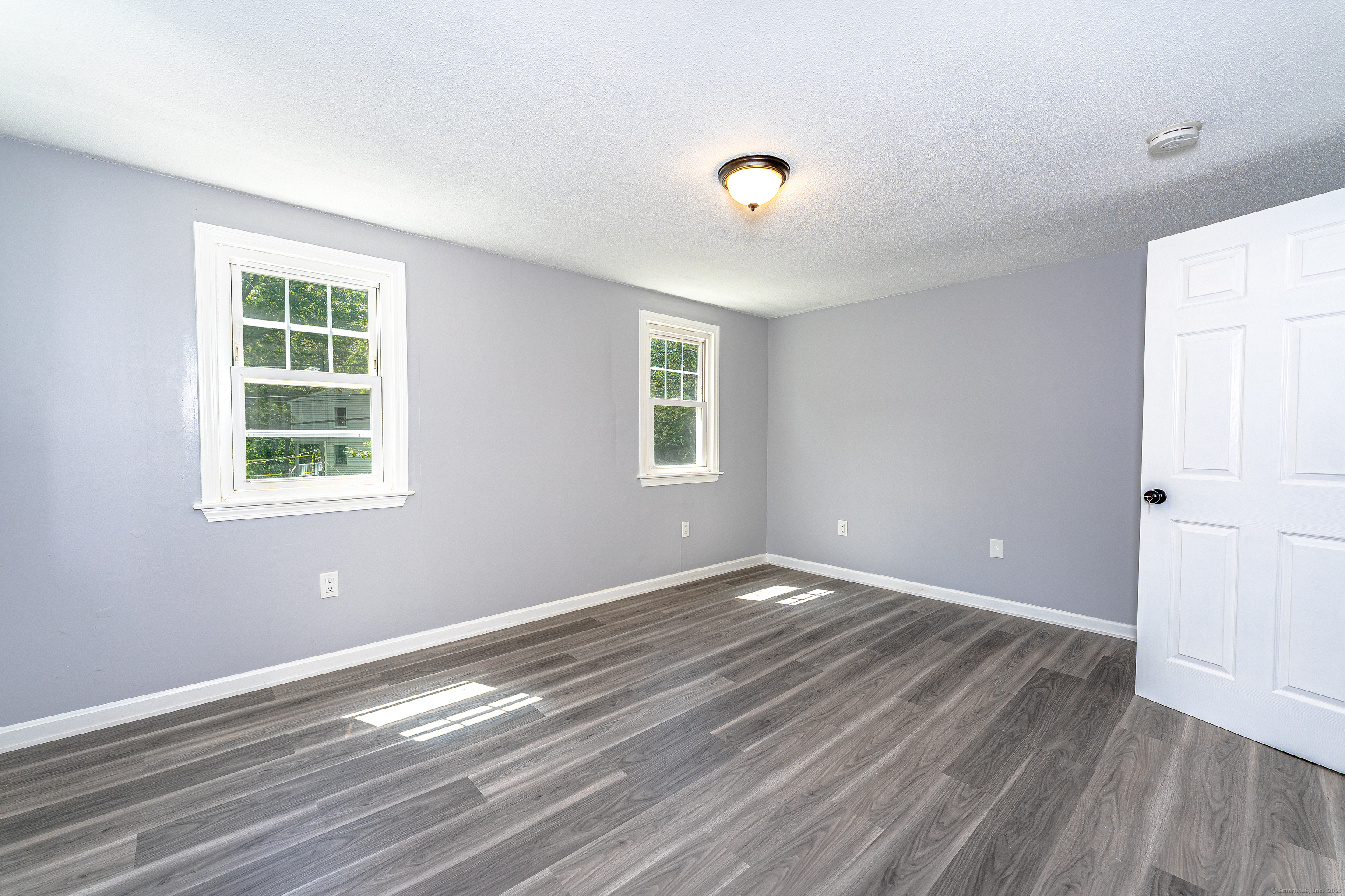 8 Ranslow Drive Wolcott, CT 06716 - Photo 23 of 31 a view of empty room with wooden floor and fan