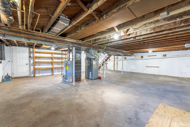 a view of empty room with wooden ceiling