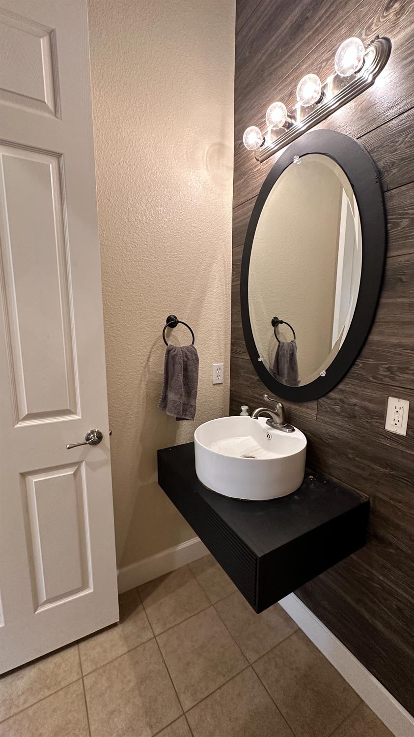1040 Birch Run Way Manteca, CA 95336 - Photo 24 of 52 a bathroom with a sink and mirror