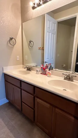 a bathroom with a toilet and a shower curtain