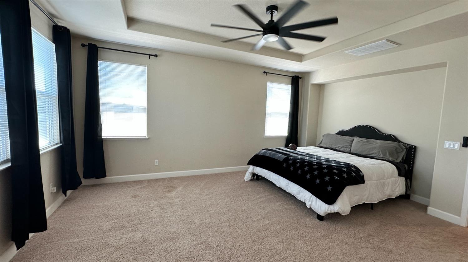 1040 Birch Run Way Manteca, CA 95336 - Photo 40 of 52 a bedroom with a bed lamp and a window