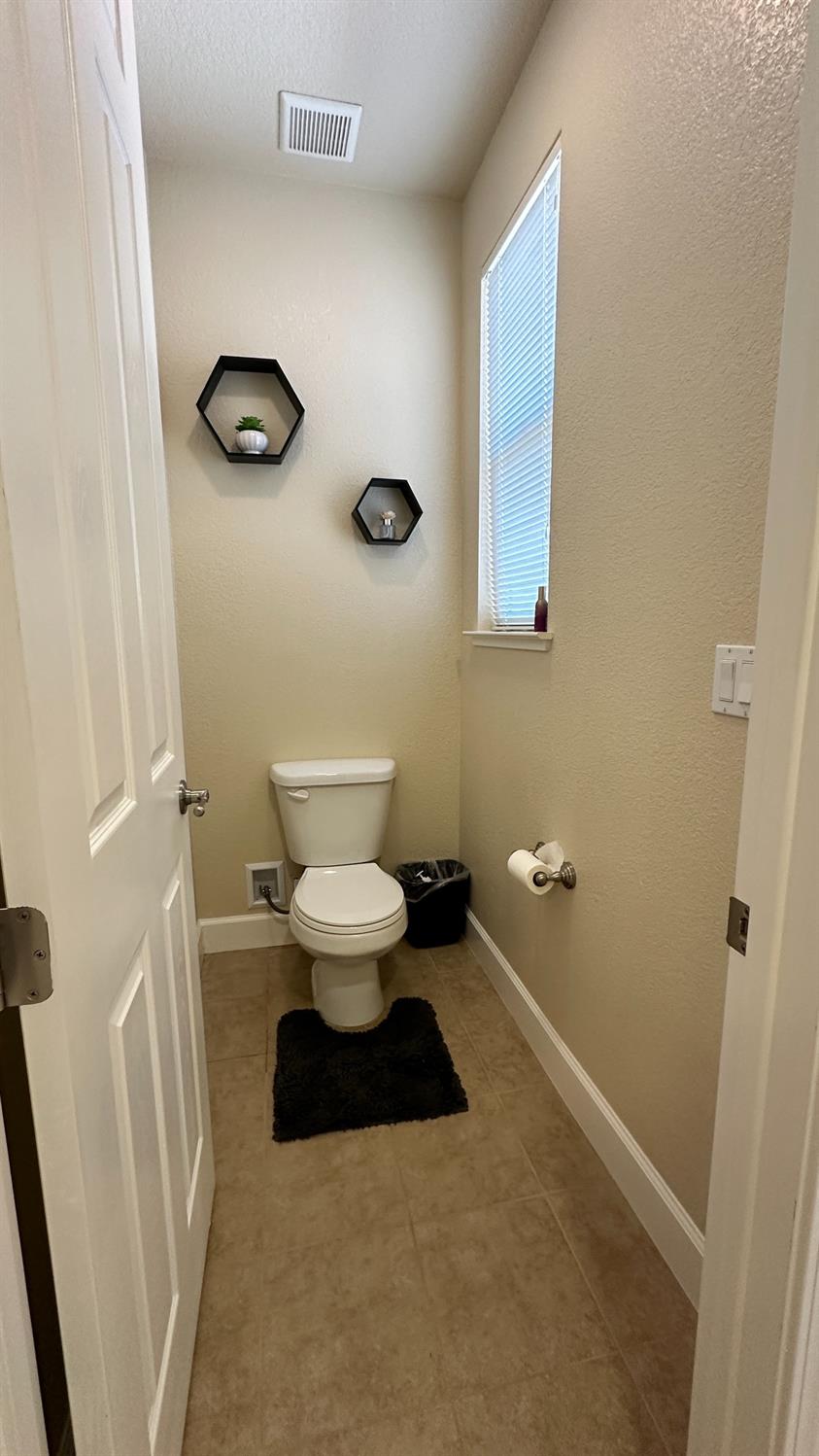 1040 Birch Run Way Manteca, CA 95336 - Photo 47 of 52 a bathroom with a sink and a toilet