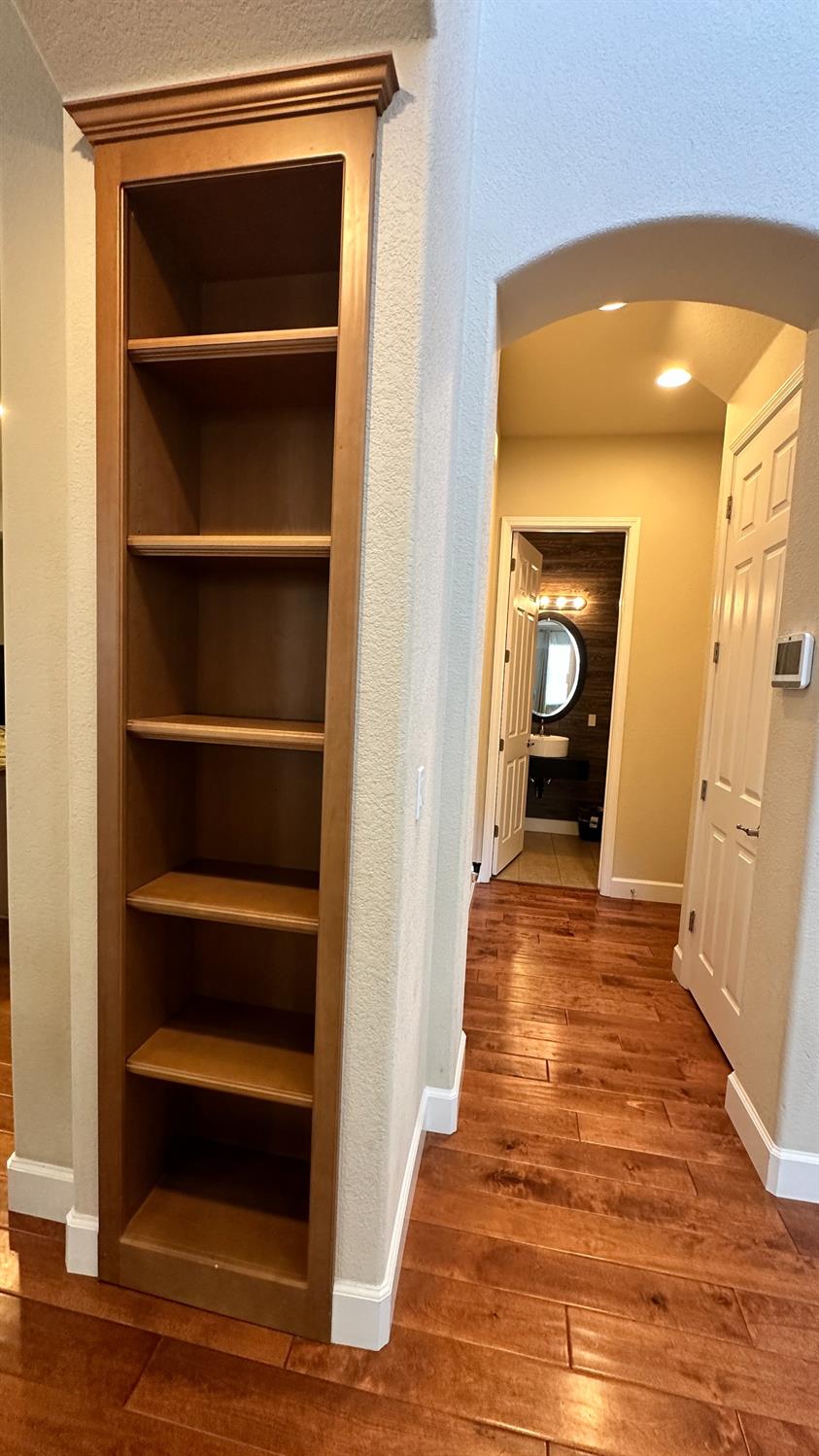 1040 Birch Run Way Manteca, CA 95336 - Photo 7 of 52 a view of a hallway with wooden floor and closet