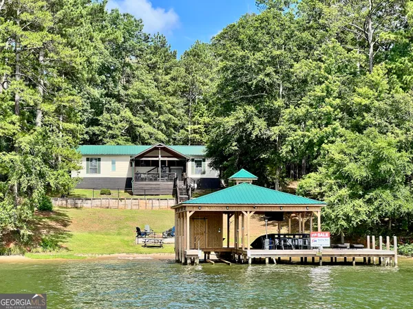 a front view of a house with a boat