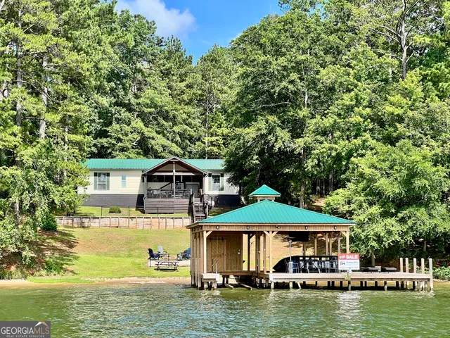 a front view of a house with a boat
