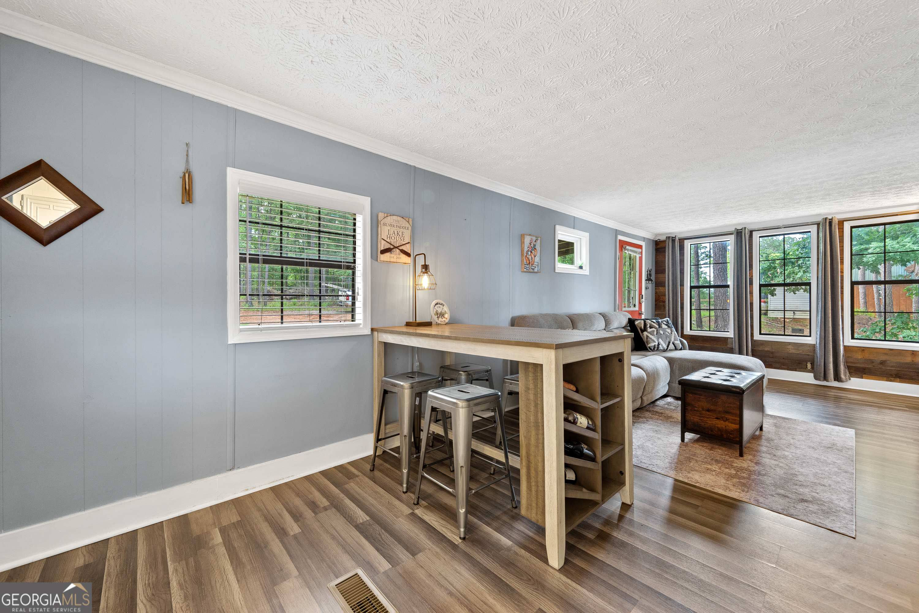 321 Barbara Point Road Sparta, GA 31087 - Photo 12 of 55 a dinning room with a window and wooden floor