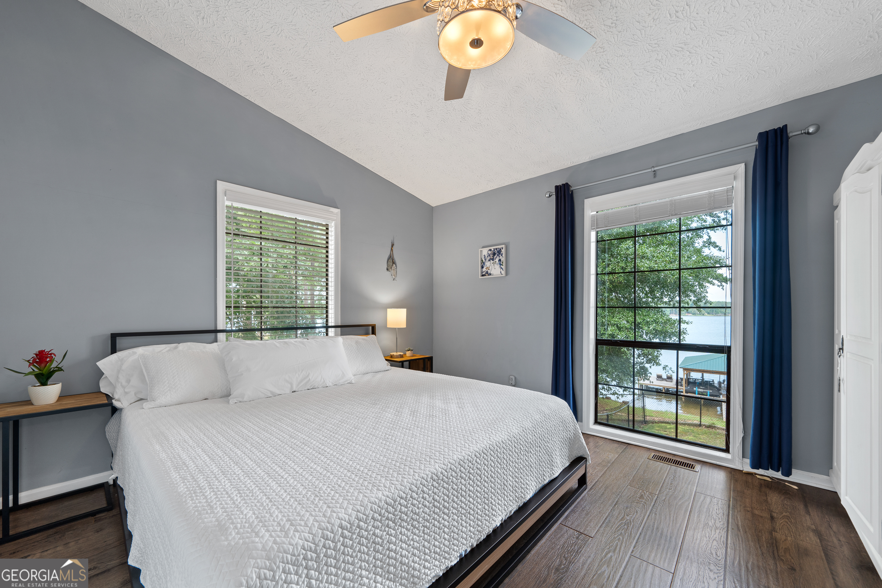 321 Barbara Point Road Sparta, GA 31087 - Photo 18 of 55 a bedroom with a bed and window